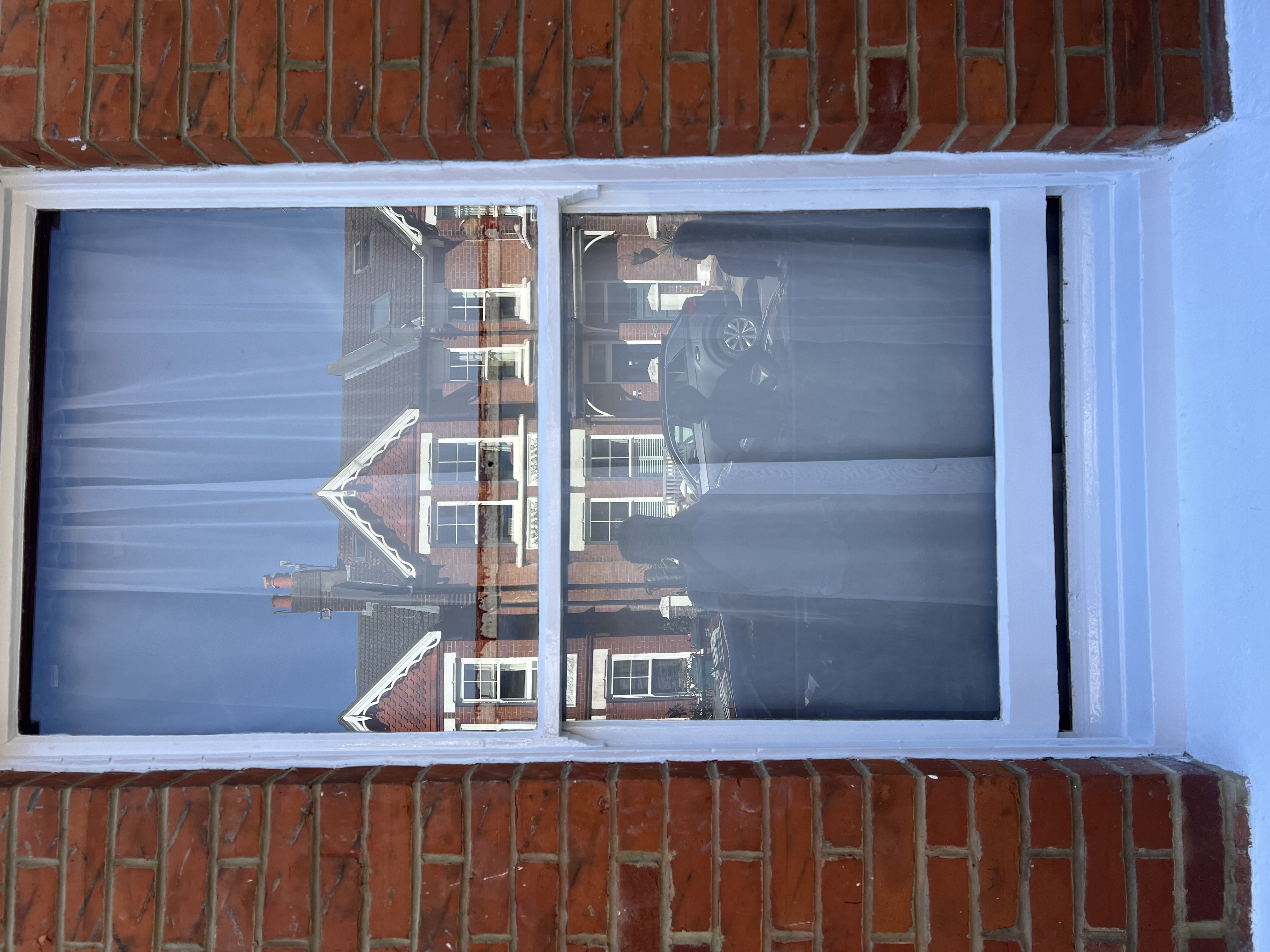 Freshly painted white timber sash window by DecorInnovations